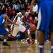 Milan player Latin Davis drives against a Gibraltar Carlson defender on Monday, March 11. Daniel Brenner I AnnArbor.com